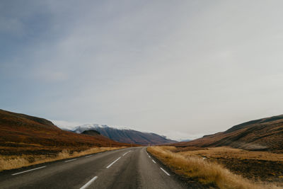 View on the road leading towards mountains in iceland