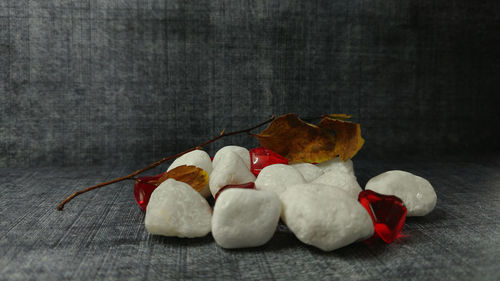 White stones with leaf on wood