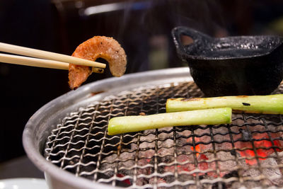 Close-up of meat on barbecue grill