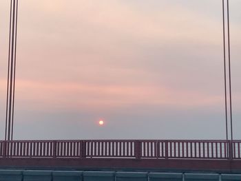 Bridge against sky at sunset