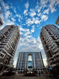 Low angle view of modern buildings against sky