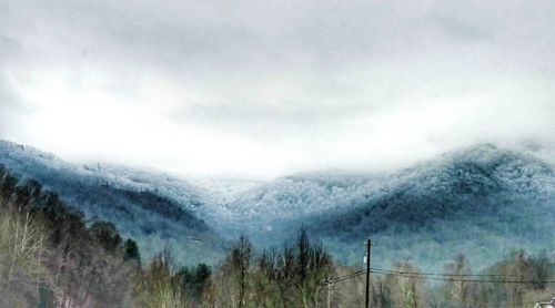 Scenic view of mountains against sky during winter