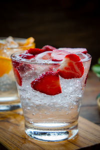 Close-up of drinks with fruits on table