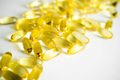 Close-up of pills on white background