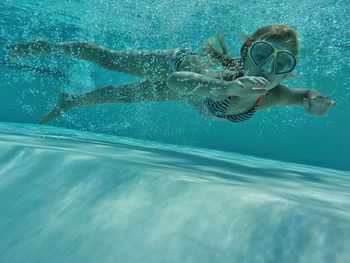 Portrait of girl swimming in pool