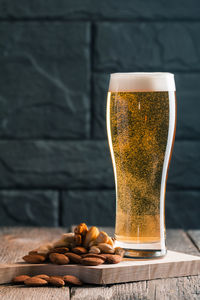 Close-up of beer glass on table