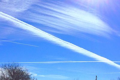 Low angle view of vapor trails in sky