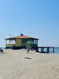 Scenic view of beach against clear sky