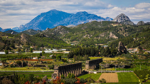 Roman aqueduct of the ancient city of aspendos, turkey. ancient bridge structure with a canal 