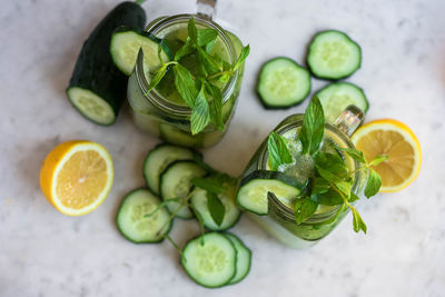 High angle view of smoothie in jar by cucumber slices