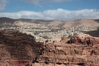 Aerial view of landscape against cloudy sky