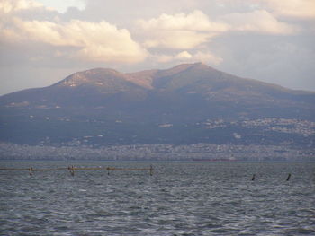 Scenic view of mountains against cloudy sky