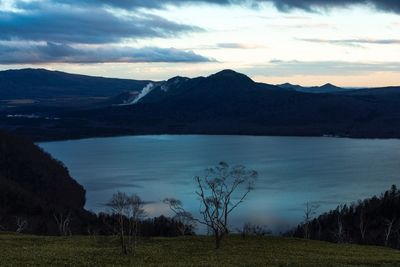 Scenic view of lake against sky during sunset