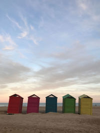 Beach huts against sky