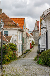 Street amidst buildings against sky