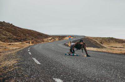 Man skateboarding on highway