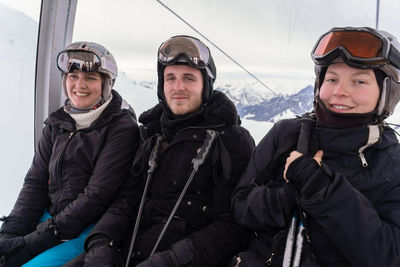 Portrait of family in elevator during ski holidays