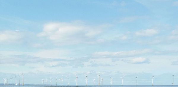 Panoramic view of wind turbine against sky