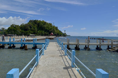 Pier over sea against sky