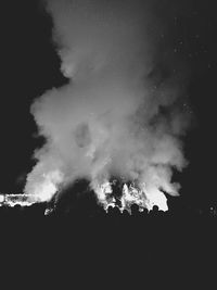 Low angle view of trees against sky at night