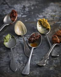 Various sauces on spoons