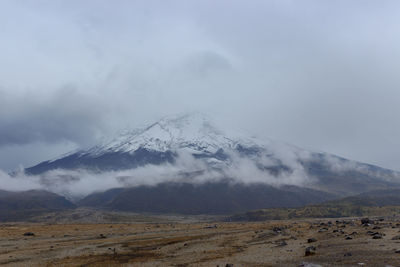 Scenic view of snowcapped mountains against sky