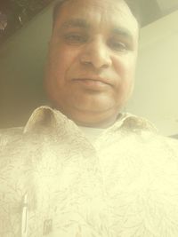 Close-up portrait of man at home