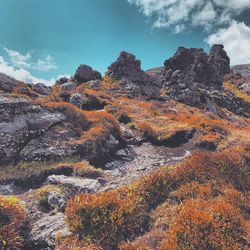 Rock formations on landscape against sky