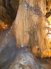 Close-up of rock formation in water