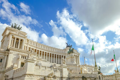 Low angle view of historical building against cloudy sky