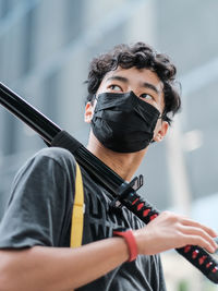 Midsection of man with mask