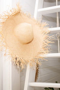 Close-up of hat on table against window