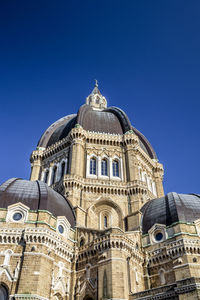 Low angle view of a building against blue sky