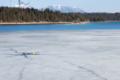 Scenic view of lake against mountain range