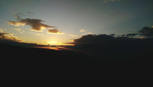 Scenic view of silhouette landscape against sky during sunset