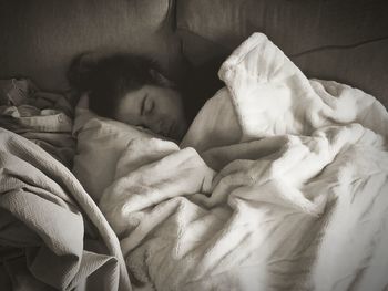 Cute baby sleeping on bed at home