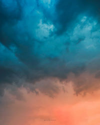 Low angle view of dramatic sky during sunset