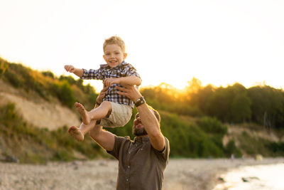 Family at the summer vacation. father and son having fun at the seaside