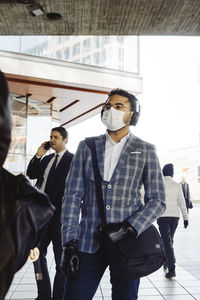 People in city street with face mask