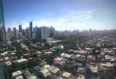 Aerial view of cityscape against sky