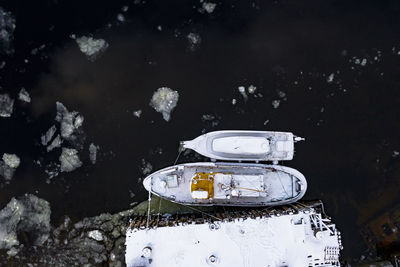 High angle view of abandoned boat on field during winter