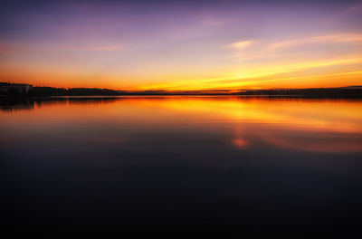 Scenic shot of countryside lake at sunset