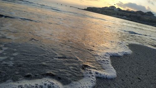 High angle view of beach against sky during sunset