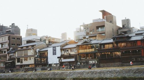 Buildings against clear sky in city