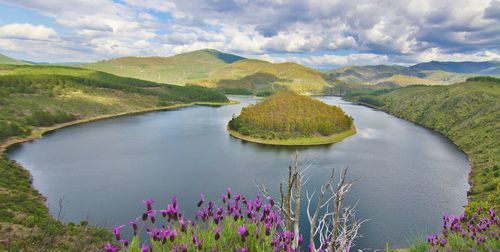 Scenic view of lake against cloudy sky