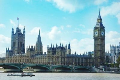 Tower bridge over river in city