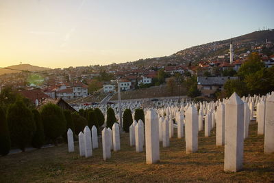 Panoramic shot of buildings against sky at sunset