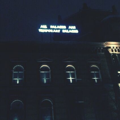 architecture, text, built structure, night, illuminated, western script, building exterior, communication, low angle view, information sign, information, building, no people, window, capital letter, non-western script, outdoors, city, sign, transportation