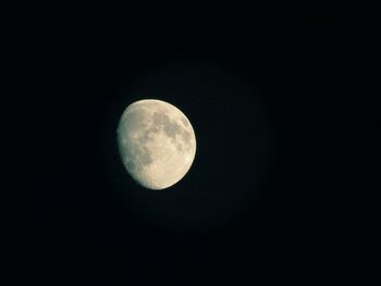 Low angle view of moon against black sky