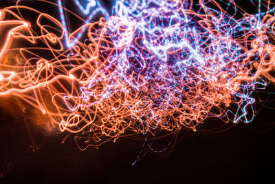 Close-up of illuminated light trails at night